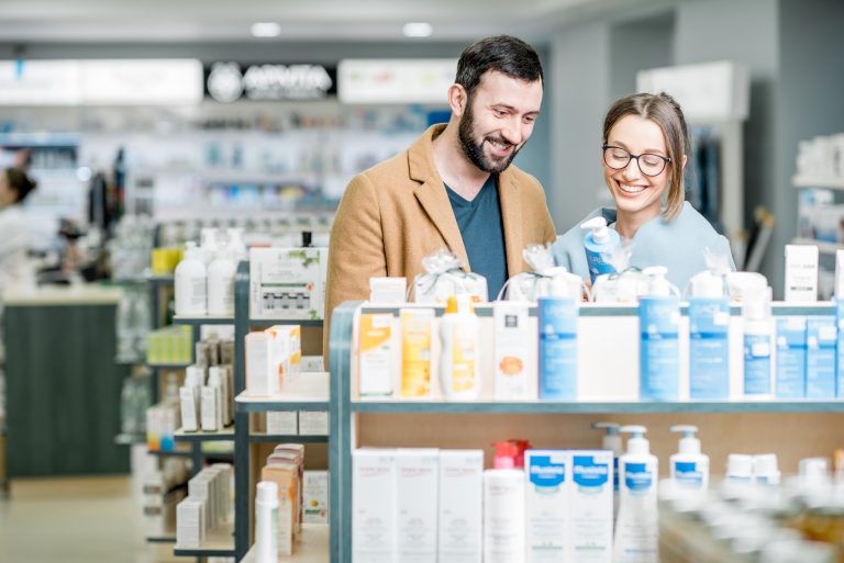 a man and woman looking at products in a store